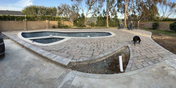 New coping, tile and pavers installed. Love the bullnose step edge and trim all the way around as well as the smooth ramp to the pool deck.