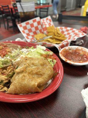 Part of the chimichanga, chips and salsa. His guacamole is long gone, it was so good!