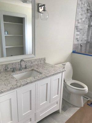 Remodel toilet and bathroom vanity with under mount sink