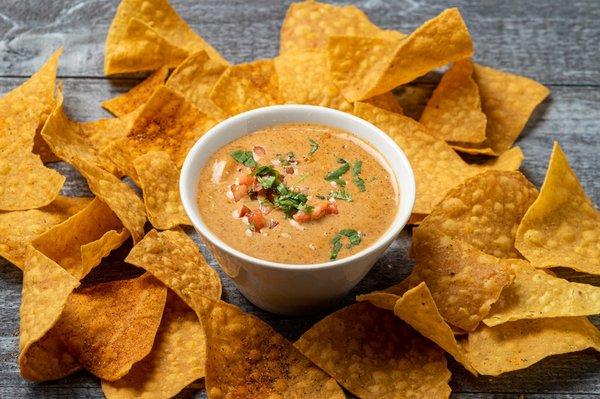 Smoky queso dip with seasoned chips!