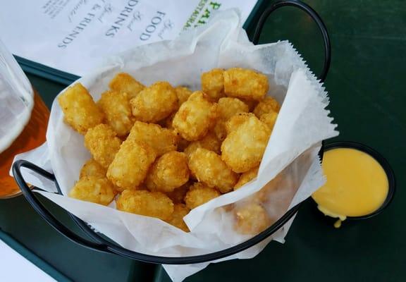 Tator tots with cheese sauce