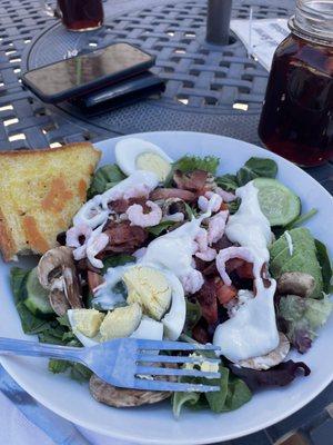 Half a Cobb salad with shrimp and bacon