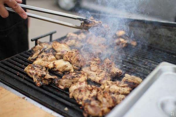 Meat being cooked over hot mesquite