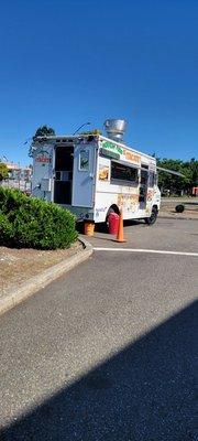 Check in! The truck is actually at the corner of Marvin and Quinault. It shares a spot with the shell gas station.