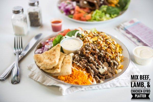 Mixed Beef,Lamb, and chicken platter with basmati rice, salad,pita, and house sauce