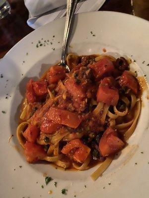 Putanesca on fettucini (Black olives, capers, garlic, onion and a hint of anchovy in a red sauce)