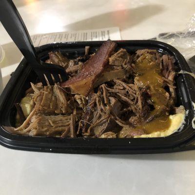 Triple Meat bowl with a cheesey potato base, corn bread and a side of pit beans!