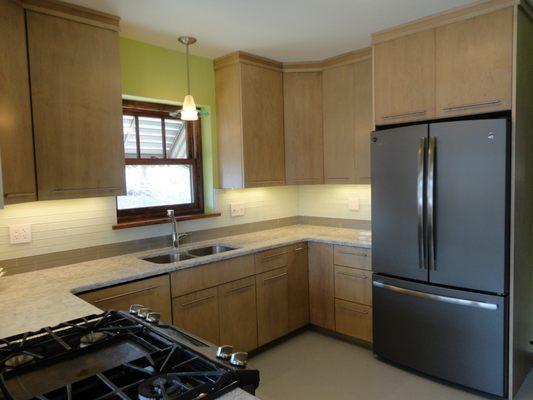 St. Louis Hills area kitchen after renovation. Soffit above sink was removed to create more cabinet space, a modern look, and an open feel.