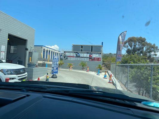 Car wash entrance behind dealership