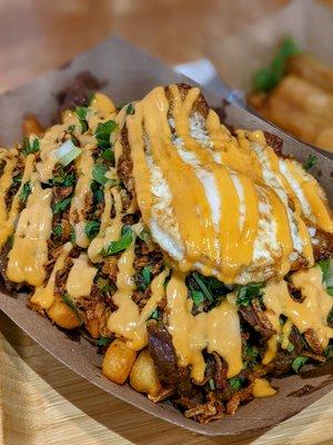 Steak fries with fried egg