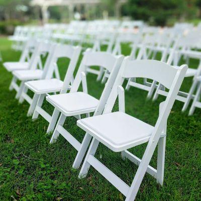 White folding chair with padded seats for rent