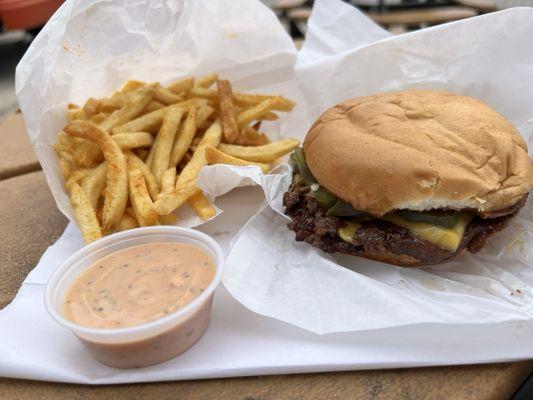 Jalapeño cheeseburger w/ seasoned fries and everything sauce