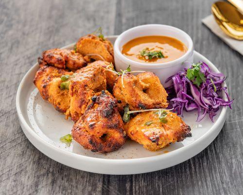 Boneless chicken marinated with mango, flavorful spices and cooked on grill.