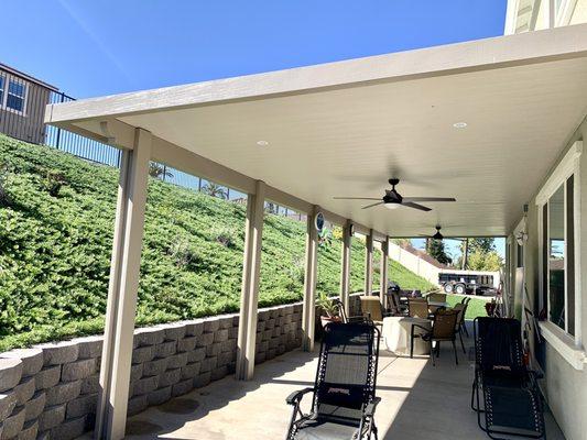 Flat pan alumawood patio cover with two fans