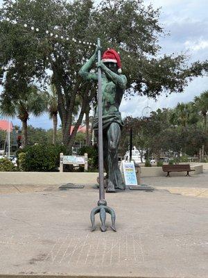 Poseidon/ Neptune has been here a long time protecting this cove . What is on his head ??