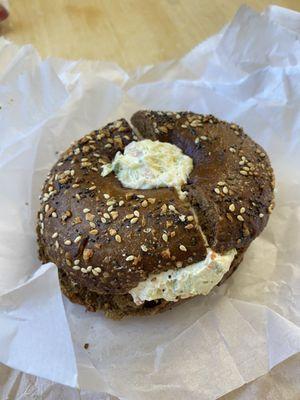 Everything pumpernickel bagel with veggie cream cheese