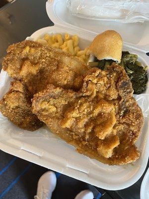 Fried pork chop, mac and cheese and turnip greens and a little piece of hot water cornbread