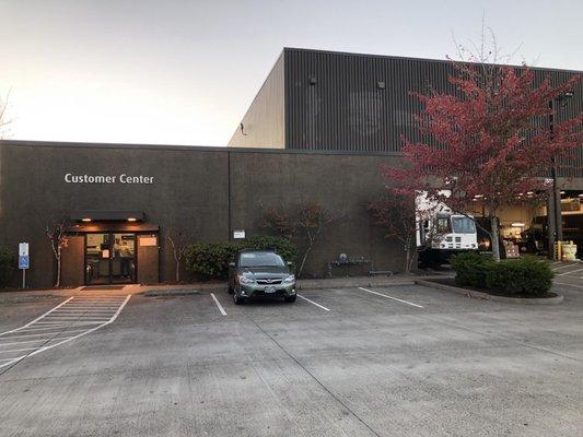 Customer Center has sliding glass doors  and 4 curbside parking spaces plus a handicap space.