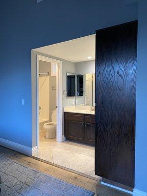 Master bath: before. View of linen closet, door to bath and wall with medicine cabinet that gets removed.