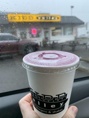 Boysenberry milkshake from the drive thru at 8:30 a.m. on Sunday 22 October 2023.