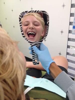 Jacob happy getting his braces placed by Dr. Karla Thompson.