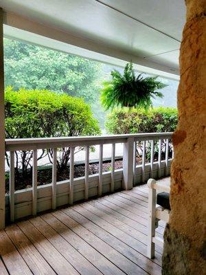 Front deck outside lodge room during a heavy rain