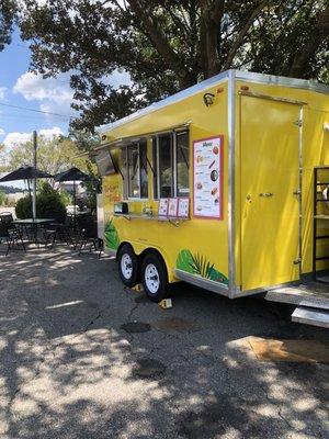 The food trailer in the shade