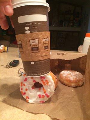 A stall donut with the full weight of my latte on top of it