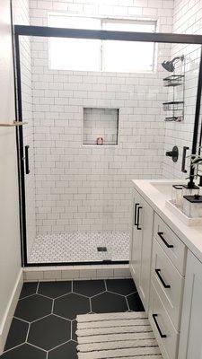 Two sliding glass shower doors