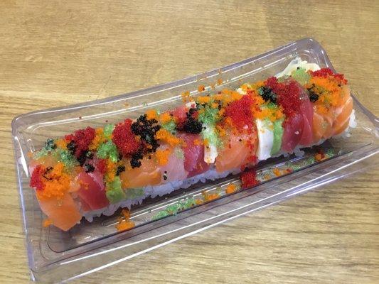 Christmas Roll  ($18)- tuna and salmon inside topped with assorted fish, fish roe and avocado