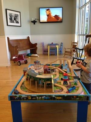 Waiting area for unwell patients complete with train table, books and other toys.