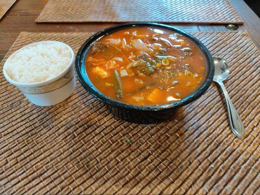 A7. Kimchi chigae (stew) with beef and rice.