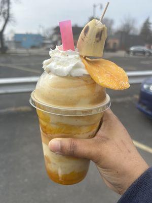 Banana mango smoothie with peanut butter and granola