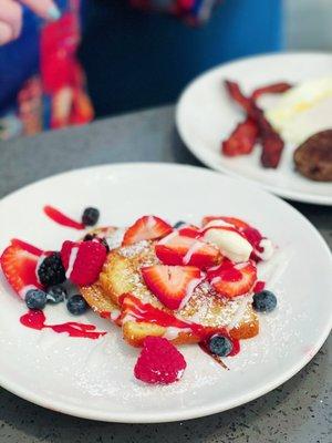 Combo breakfast with very berry pancakes.