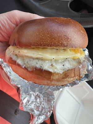 Sausage egg and cheese on a brioche bun.