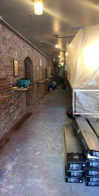 Over 100 feet of brick undercutting at Bar Cava Wine Whiskey & Eatery.