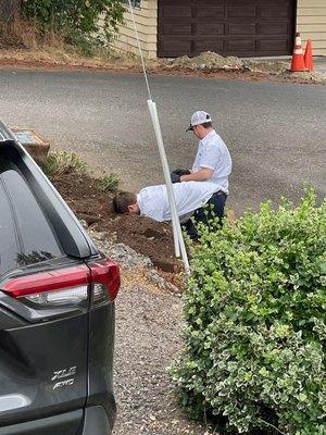 Them repairing the broken water pipe