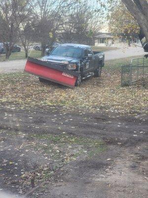 Truck with snowplow