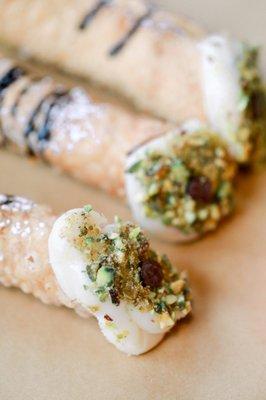 Fresh home made cannolis with pistachio and chocolate.