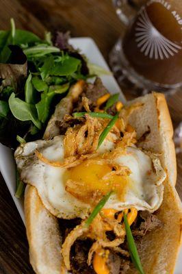 Korean Philly Cheese steak with Marinated Ribeye meat, crispy Furikaki Onions....Add a Sunny Side Egg!