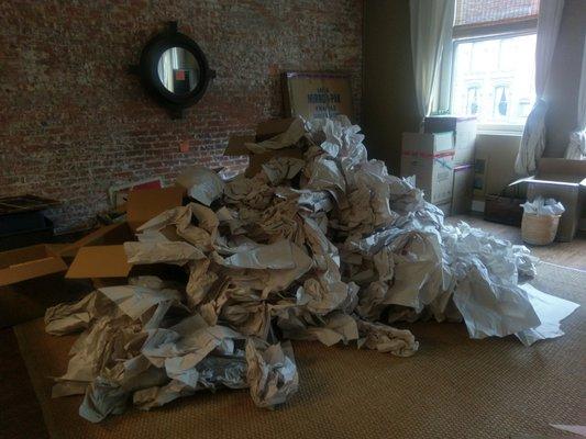 The excess paper I removed to repack boxes on day 2 of packing.