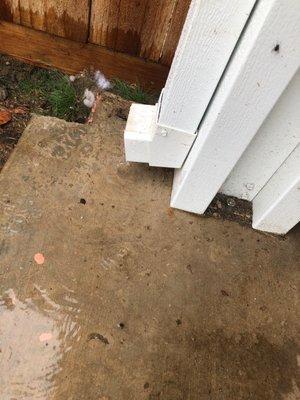 Downspout drains onto patio.