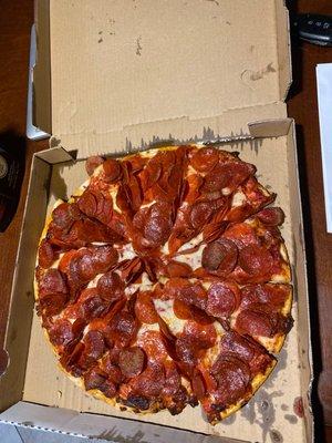 Triple pepperoni pizza