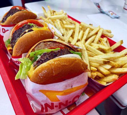 Cheeseburger (front) and double double cheeseburgers (back) with fries  IG: @fooddeclassified