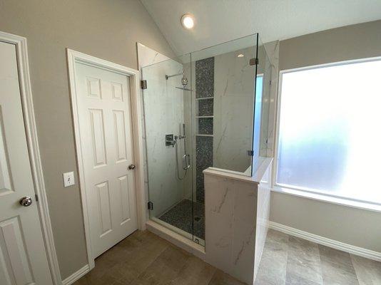 Home Platinum Services transformed a tired bathroom into a luxury space with stylish details, custom fixtures, and a walk-in shower.