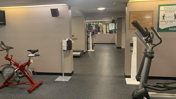 Gym that has an empty vending drink machine.