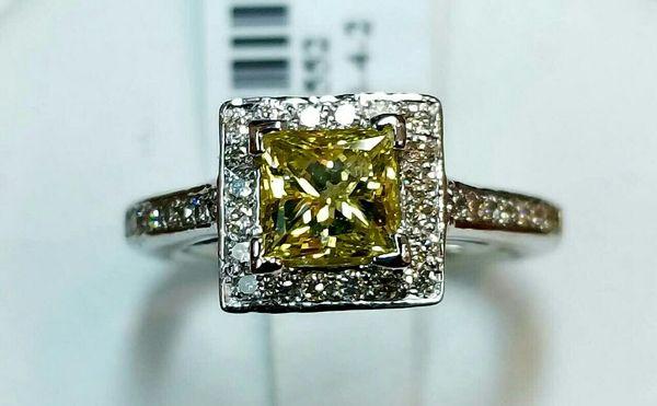 18K White Gold Lady's Yellow Fancy Princess Cut 1ct center with 0.55ct Round White Diamonds 0.55ct total.