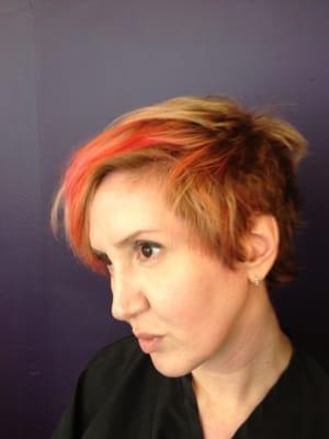 Lisa Sardegna, client of 16 years, whose long hair was recently transformed into this exhilarating short style with bold color.