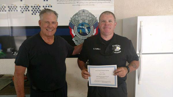 Sean Collins with instructor Pete Quimby at Lee County Port Authority range during Active Treat firearms training.