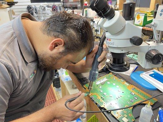 One of our techs replacing the HDMI port on a PlayStation 5